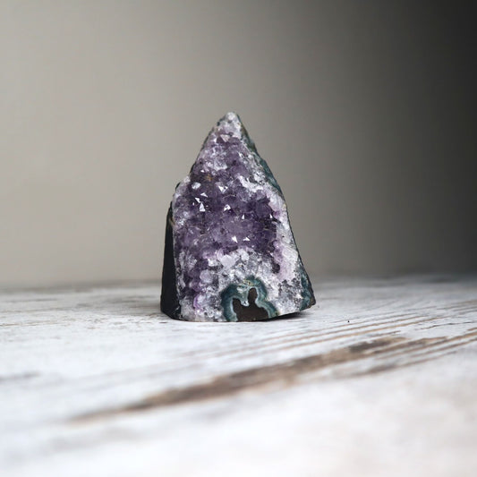 Amethyst cut-base cluster with deep purple crystal points.