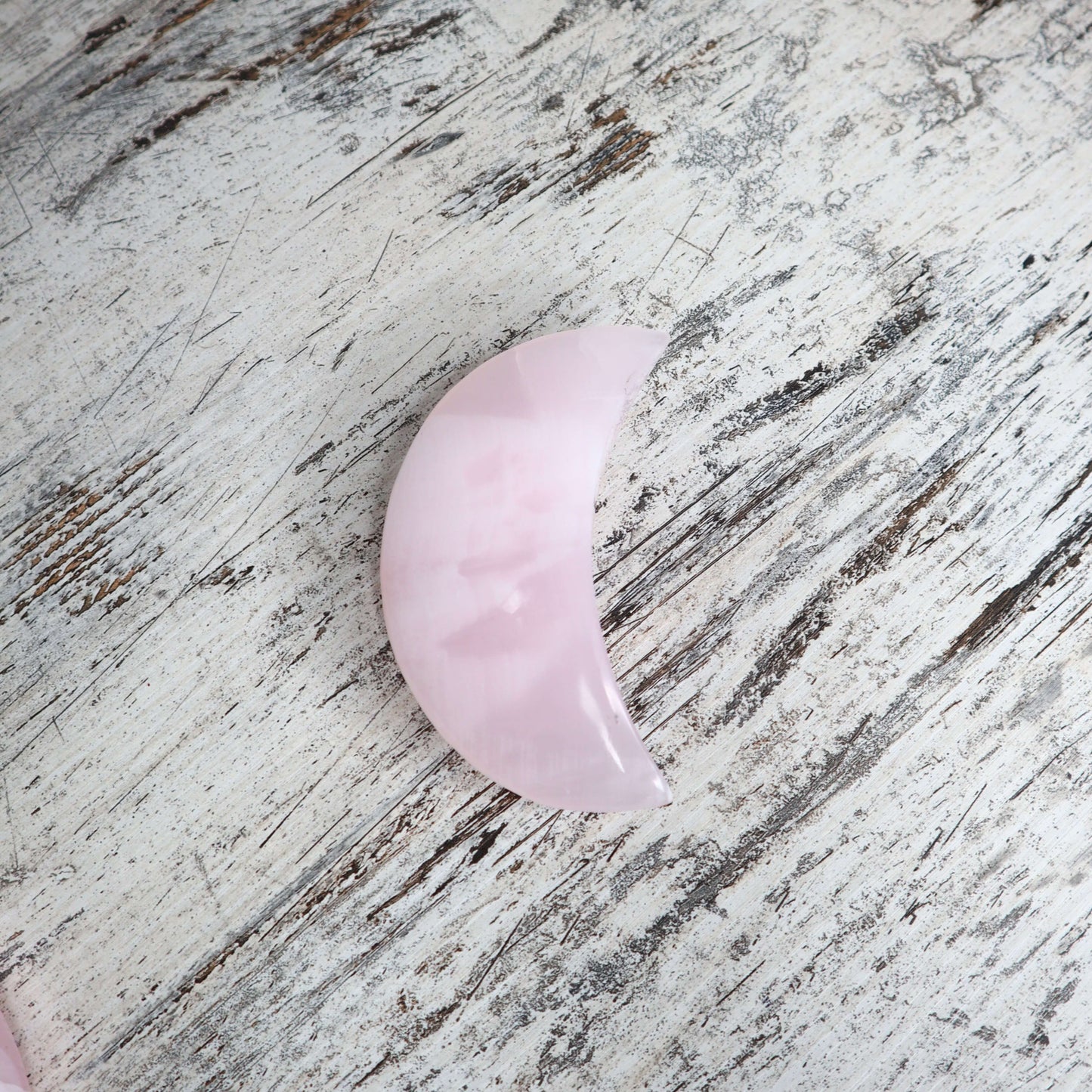 Moon Carving Crystal for feminine, heart-healing energy.