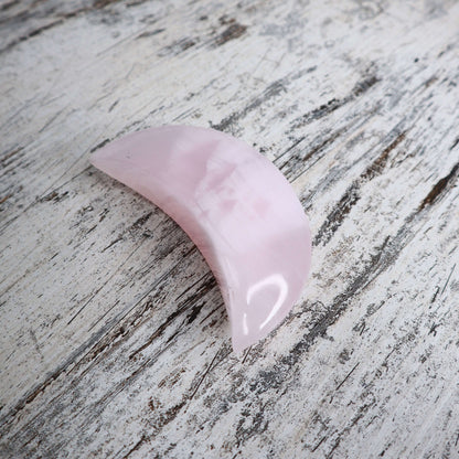 Mangano Calcite crescent moon with gentle, nurturing energy.