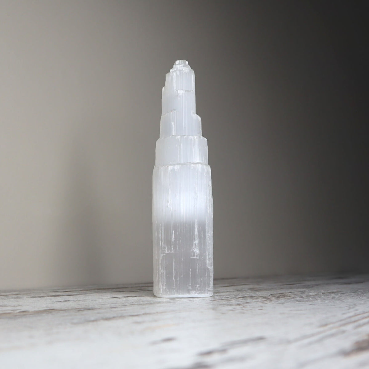 Selenite tower with white striations for energy cleansing.